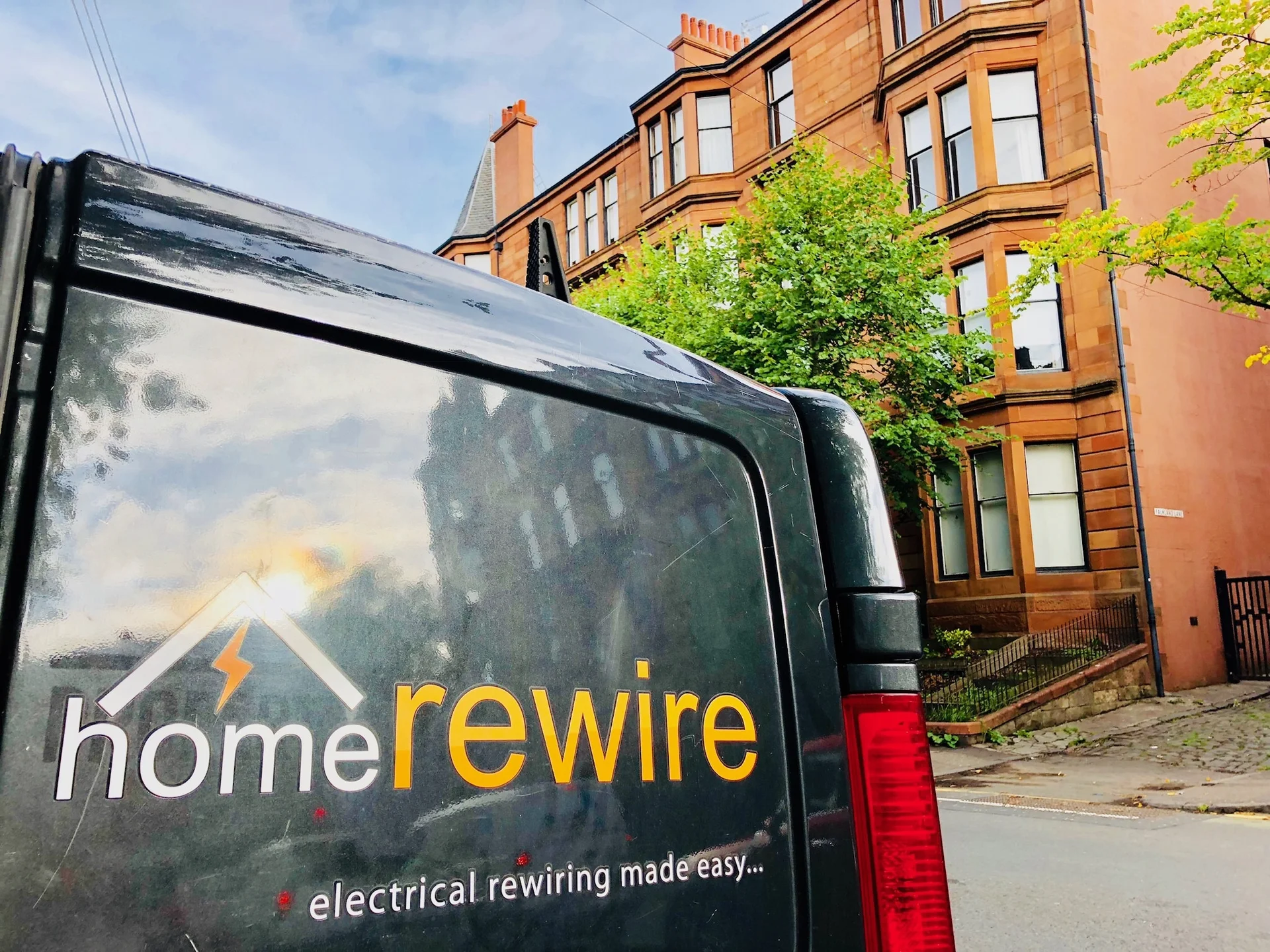 HomeRewire electricians and van on a rewire in Paisley