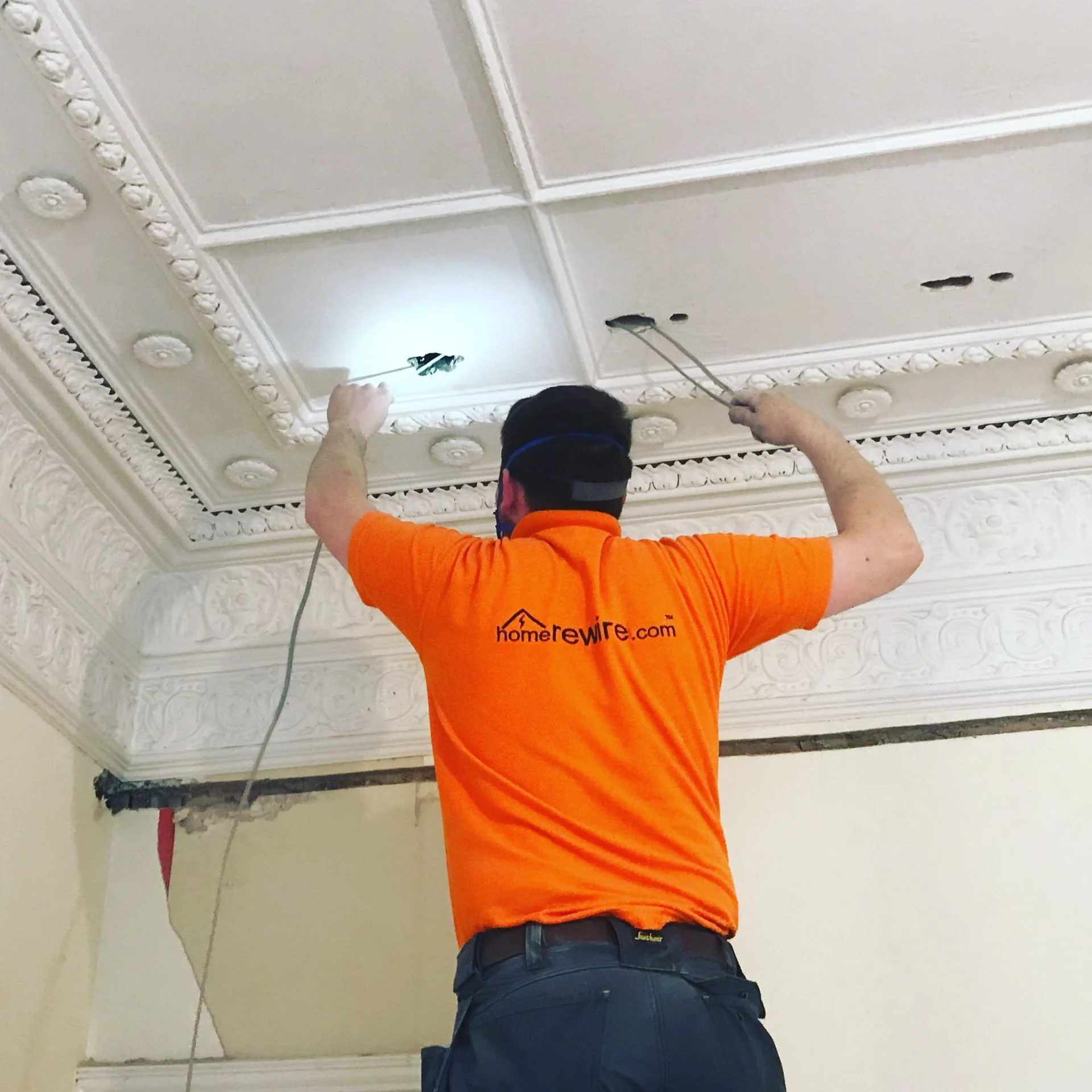 HomeRewire electrician chasing a wall to run new cable